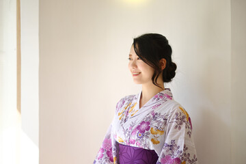 Japanese woman in yukata in coffee shop