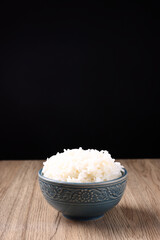 Thai rice isolated on wood background