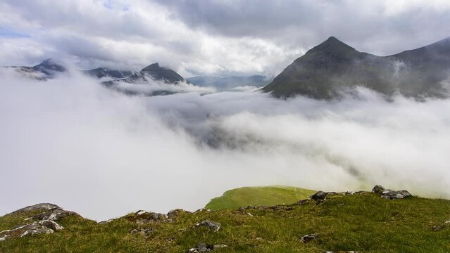Time lapse of spectacular mountains and fjords near the village of Funningur in Faroe Islands, Denmark.
