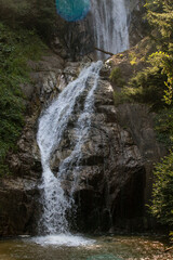 Manle waterfall. Waterfall flowing in the green forest. Manle Waterfall in Rize ikizdere