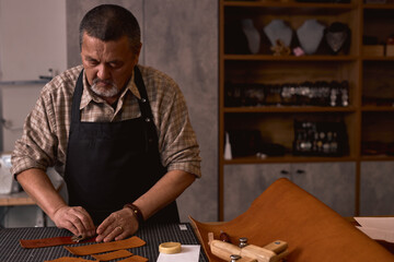 artisan makes leather long-lasting,close up portrait, the secret of high-quality leather