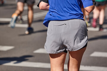 Fototapeta premium Runners on the street. Healthy lifestyle. Jogging exercise. Athletics