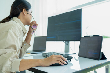 Female IT programmer innovates at office desk.