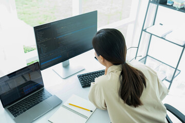 Female IT programmer innovates at office desk.