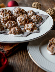 Elisen Gingerbread Cookies on a christmas plate on wooden table