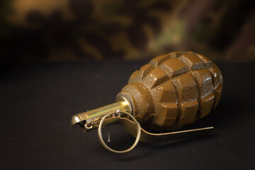 Hand grenade on a dark background
