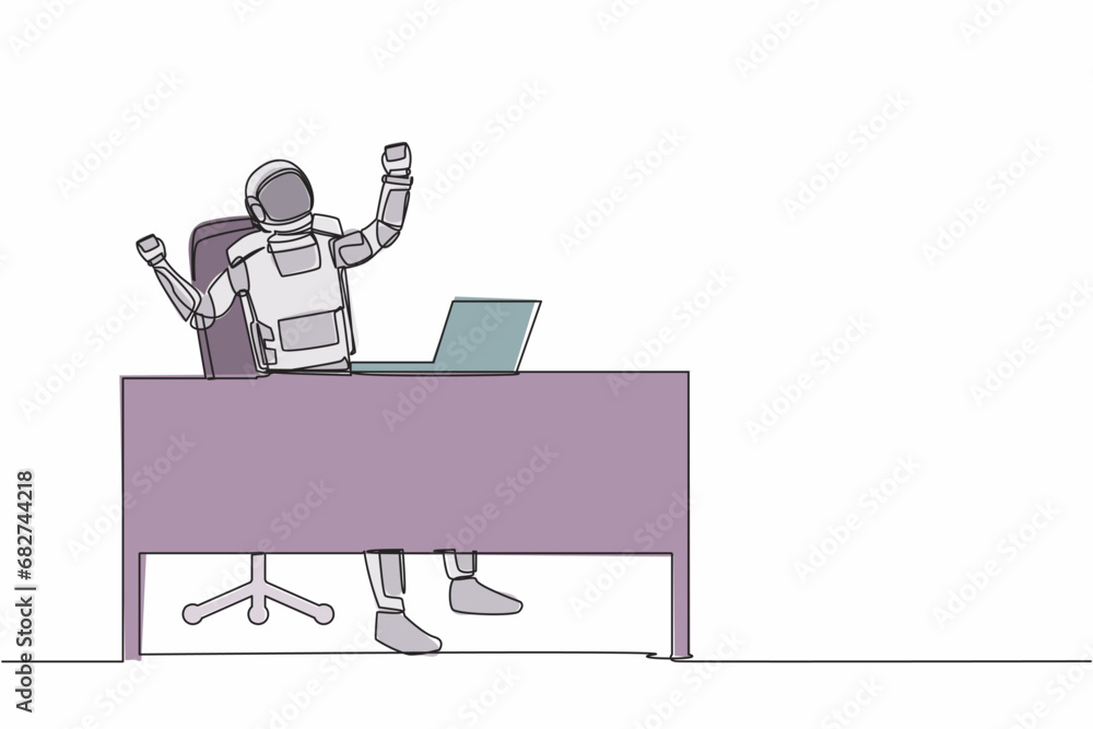 Poster single continuous line drawing happy young astronaut at working desk celebrating win with hands rais