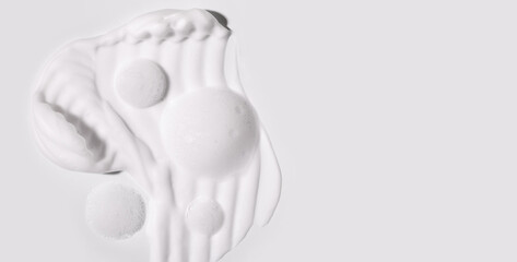 texture foam mousse foam cosmetic smear sample on a light background