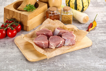 Uncooked raw pork tenderloin medallions