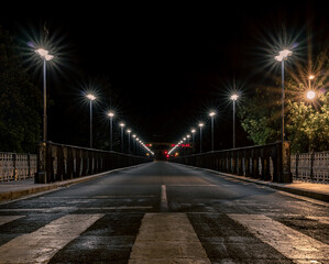 Enlighted road over an urban bridge at night