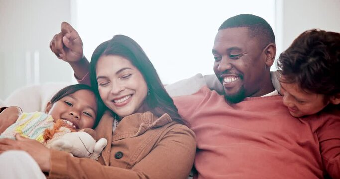 Mother, father and children love on sofa in home or family development, bonding or relax holiday peace. Interracial, son and daughter hug on couch or youth safety or parent trust, vacation or weekend