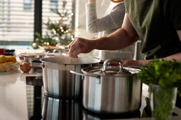 Caucasian couple preparing food before Christmas