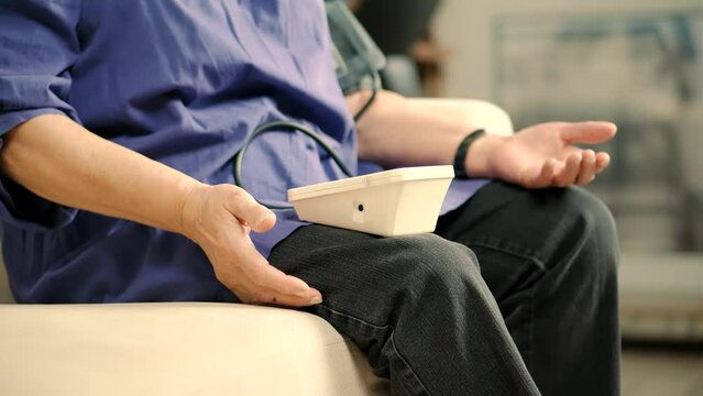 Woman checking blood pressure hypotension diagnostic on medical tonometer