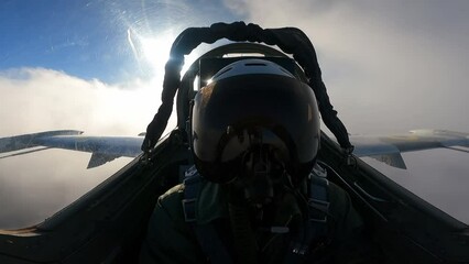 A pilot in a helmet inside the cockpit of a fighter - Powered by Adobe