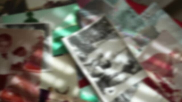 archival photos lie on the table in the rays of the sun in defocus
family archive
background texture from out of focus photos