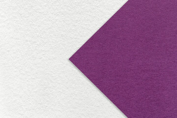 Fototapeta premium Texture of white paper background, half two colors with violet arrow, macro. Structure of craft purple cardboard.