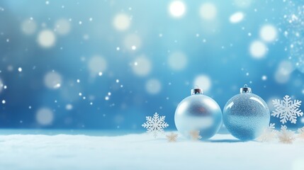 Fototapeta na wymiar two silver and blue ornaments on snow