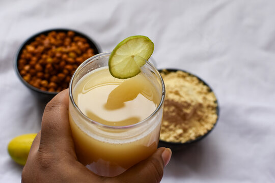 Chana sattu is a summer drink, prepared by dry roasting grains or grams, mainly barley, sugar, salt, lemon, and water. Selective focus on sattoo drink is made of roasted gram powder.