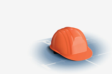 an orange color helmet lying on blueprint