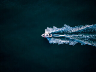 Aerial view of speed motor boat on open blue sea