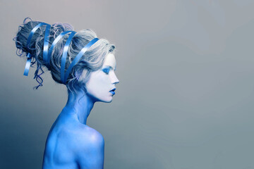Winter cool cold woman with blue and white body art, carnival makeup and hairstyle - obrazy, fototapety, plakaty