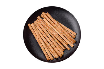 Delicious fresh grissini sticks with salt and sesame seeds