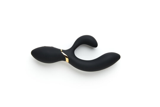 Black vibrator on the white background. Sex toys for adults. Flat lay, top view
