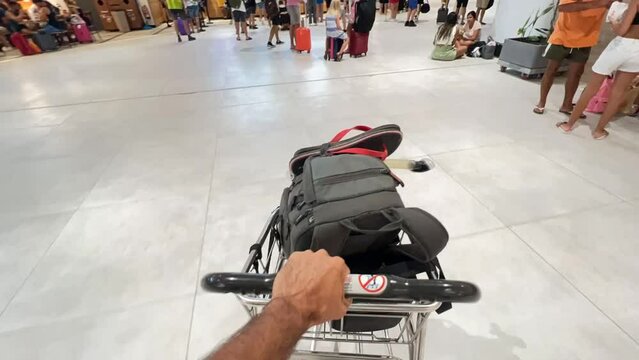 Hyperlapse - International airport with business people pulling trolley bags arriving and departing terminal tourists travelling and walking in lobby 