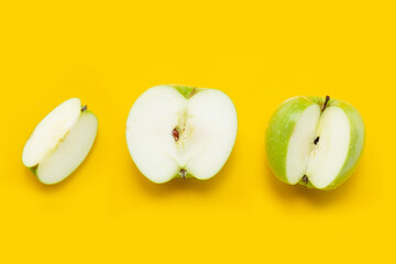 Fresh apples on yellow background.