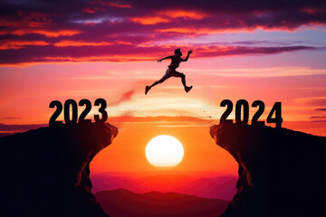 A young man jump between 2023 and 2024 years over the sun and through on the gap of hill silhouette evening colorful sky. happy new year 2023. - obrazy, fototapety, plakaty