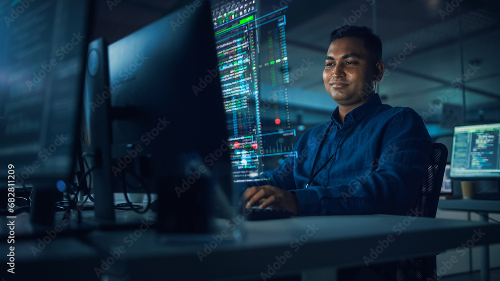 Leinwandbilder Futuristic Office with Hologram Screens: Professional Indian IT Programmer Working on Computer with Holographic Projection Showing Data and Charts. Asian Specialist Creating Innovative Software.
