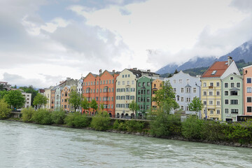 Colorful historic houses on the banks of the river in Innsbruck, Tyrol, Austria