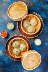 Traditional Asian national food Manti, Manta or Manty, like dumplings in bamboo steamer