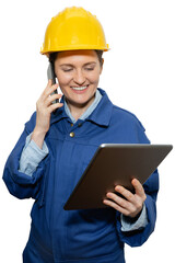 Isolated smiling woman engineer in yellow helmet and blue uniform with phone and digital tablet	