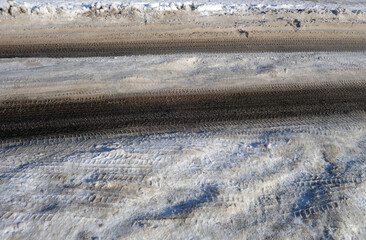 Tyre tracks on winter snow road.