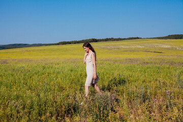 Portrait of a beautiful rural girl in a rural field