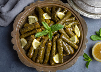Delicious dolma (sarma) stuffed grape leaves rice, white yogurt sauce. Lebanese dolma sarma on...