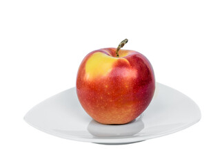 Ripe Gala apple on a porcelain plate