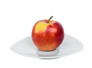 Ripe Gala apple on a porcelain plate