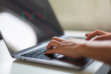 Woman working and looking at graphs