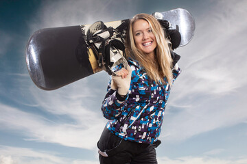 Positive beautiful young girl with a snowboard - 682851869