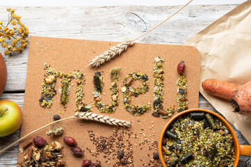 special muesli and granules for sportive horses  served in bowl around muesli background.  feeding...
