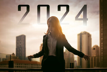 silhouette of successful business woman in sunrise with city background with text 2024 , new year...