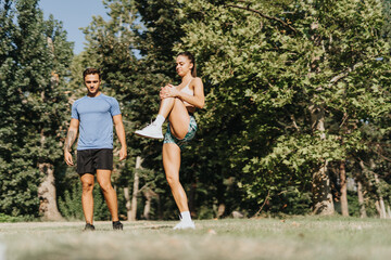 Fototapeta premium Active Couple Motivated by Fresh Air Fitness in Park