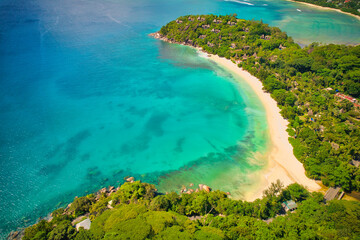 Drone photo of white sandy nase louise beach, with luxurious resort and nature landscape, Mahe Seychelles
