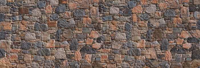 Steinmauer aus vulkanischen Natursteinen in blau, grau und rot mit verschiedenen Größen - Fuerteventura, Kanarische Inseln - obrazy, fototapety, plakaty