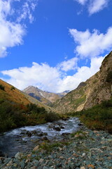 Fototapeta na wymiar Eighth stage of Ak-Suu Traverse trek from Ala-kol lake to Karakol Gorge in Karakol national park, Kyrgyzstan