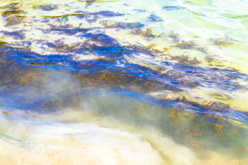 Waves at tropical beach caribbean sea clear turquoise water Mexico.