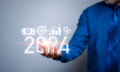 Man holding the year 2024 concept. A visionary businessman boldly embraces change, holding the key...