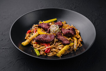 Chinese noodles with roasted duck and fried vegetables
